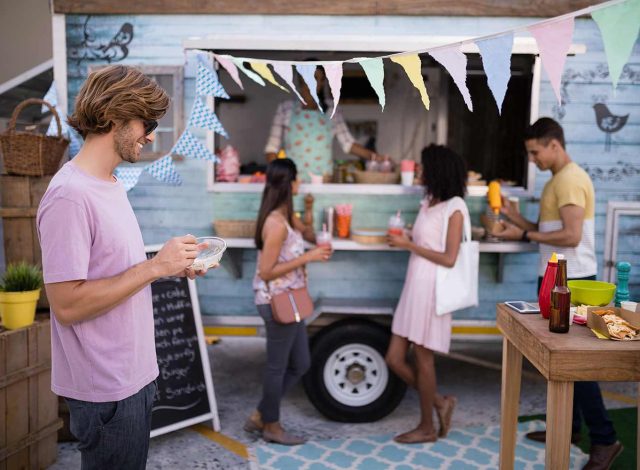 customers-having-snacks-from-food-truck-EDLBVPX.jpg